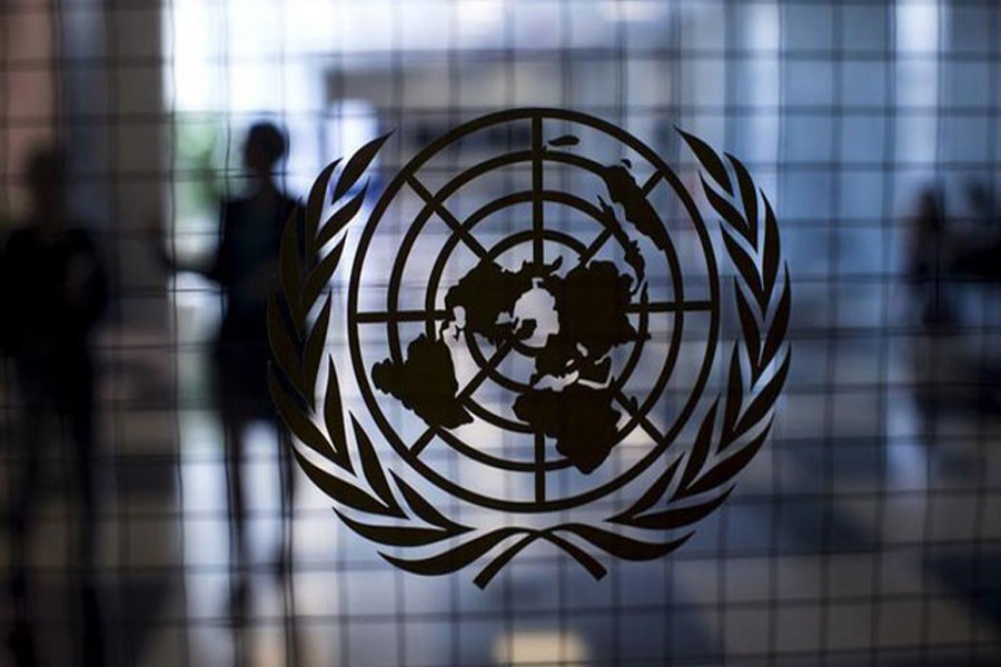 A United Nations logo is seen on a glass door in the Assembly Building at the United Nations headquarters in New York City, September 18, 2015. Reuters/Files