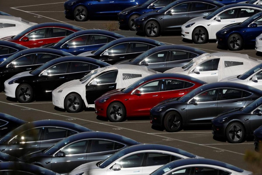 Rows of new Tesla Model 3 electric vehicles are seen in Richmond, California. Reuters/File Photo