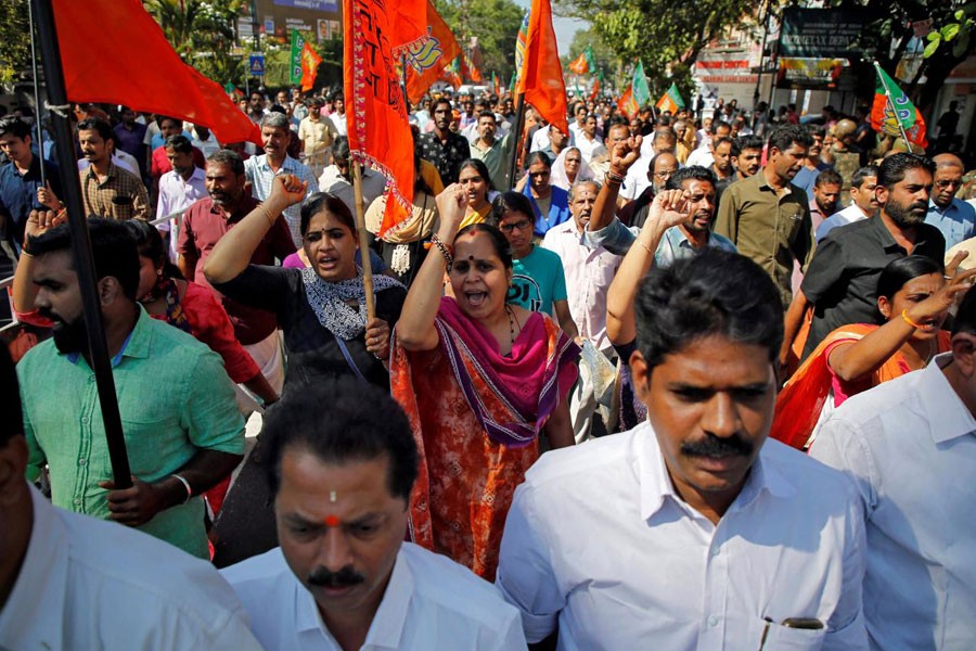 Supporters of India's ruling Bharatiya Janata Party (BJP) and Hindu nationalist organisation Rashtriya Swayamsevak Sangh (RSS) attend a protest rally during a strike against the state government for allowing two women to defy an ancient ban and enter the Sabarimala temple, in Kochi, India, January 3, 2019 - REUTERS/Sivaram V