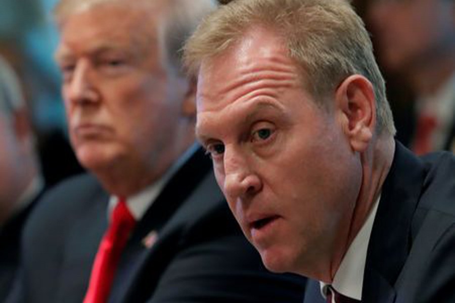 US President Donald Trump (L) listens next to Acting US Defense Secretary Patrick Shanahan during a Cabinet meeting on day 12 of the partial US government shutdown at the White House in Washington, US, January 2, 2019. Reuters/Files