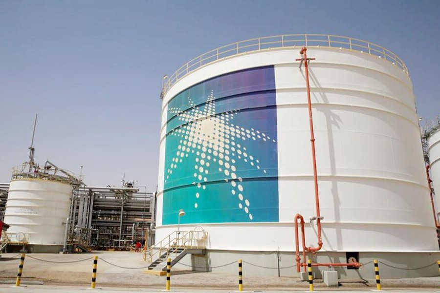 An Aramco oil tank is seen at the production facility at Saudi Aramco's Shaybah oilfield in the Empty Quarter, Saudi Arabia 	— Reuters