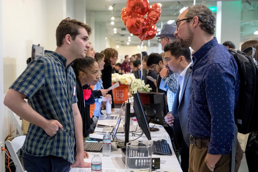 Job seekers and recruiters gather at TechFair in Los Angeles, California, US, March 8, 2018. Reuters/File Photo