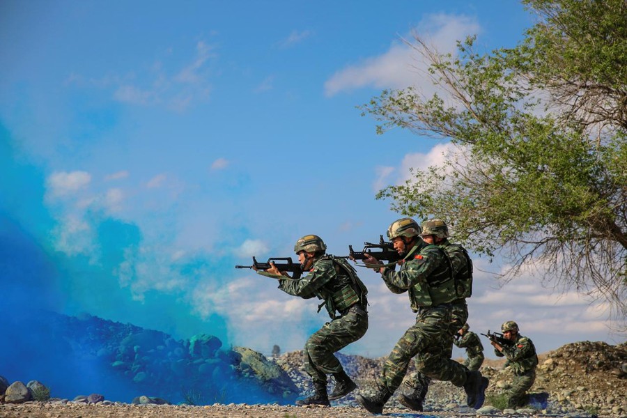 Soldiers of the Chinese People's Liberation Army (PLA) take part in a combat training in the Gobi desert in Jiuquan, Gansu province, China, May 18. Reuters/Files