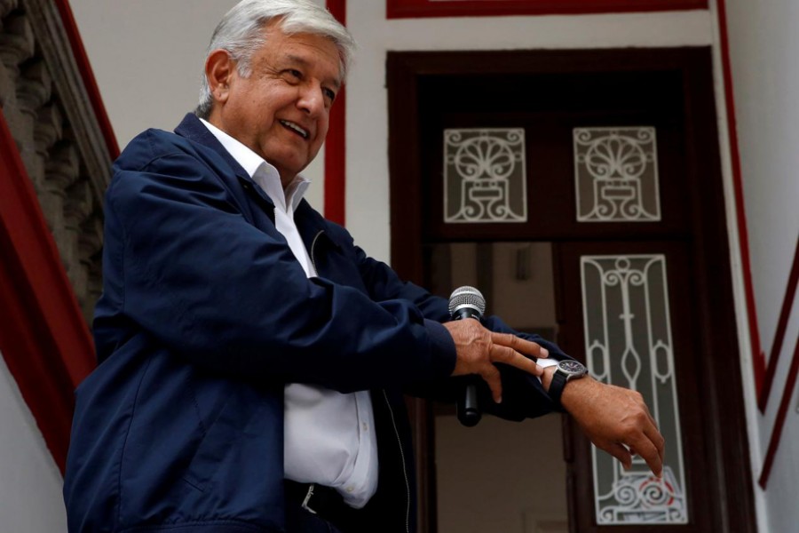 Mexico's president-elect Andres Manuel Lopez Obrador shows his watch following a question by a reporter after a news conference in Mexico City, Mexico, July 22, 2018. Reuters/File Photo