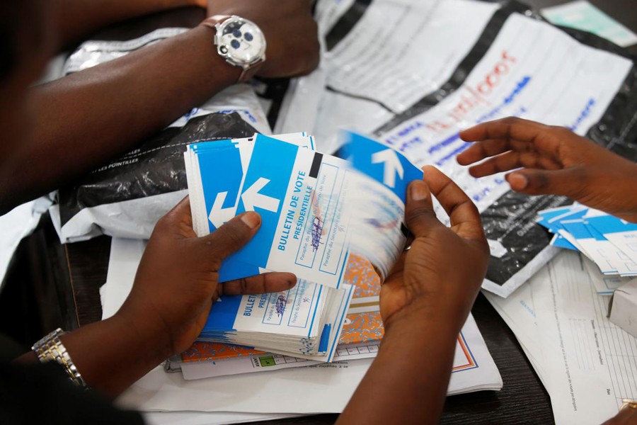 A man examines voting materials at Congo's Independent National Electoral Commission (CENI) tallying centre in Kinshasa, Democratic Republic of Congo, January 1, 2019. Reuters/Files