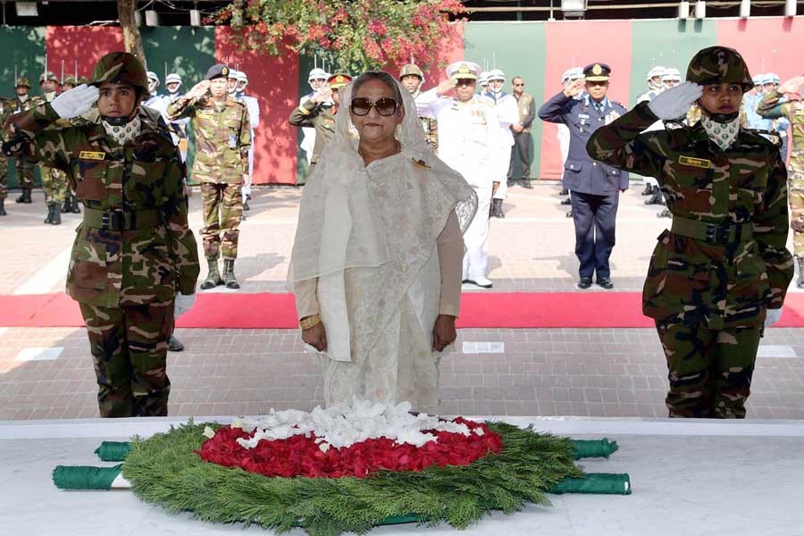 Prime Minister Sheikh Hasina standing in solemn silence as a mark of profound respect to Father of the Nation Bangabandhu Sheikh Mujibur Rahman at Tungipara of Gopalganj district on Wednesday (Focus Bangla)