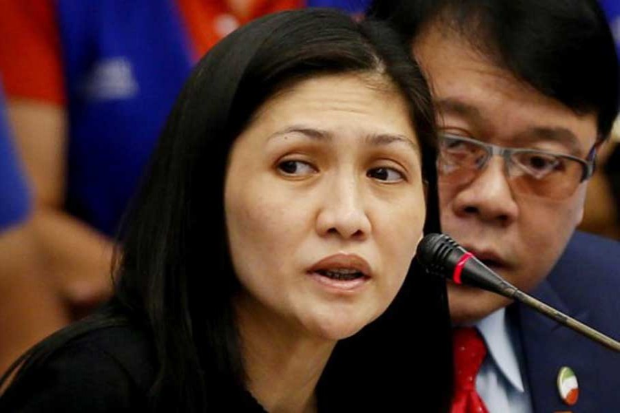 Maia Santos Deguito, branch manager of the Rizal Commercial Banking Corp (RCBC) answers questions during a money laundering hearing at Senate in Manila April 5, 2016. At right is her legal counsel Fernando Topacio. - Reuters