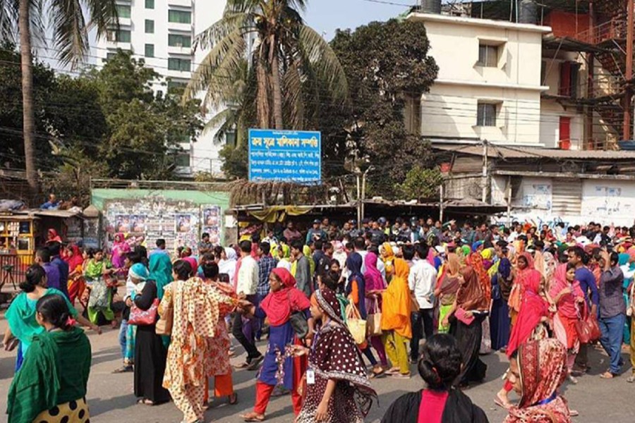 A view of ready-made garment workers taking to streets in Dhaka city