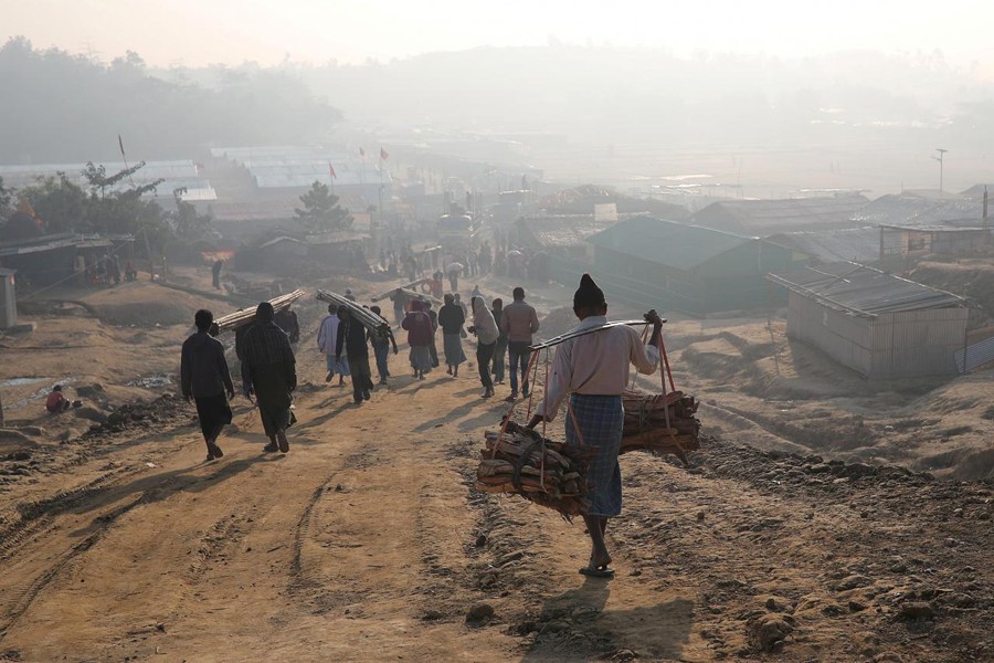 Rohingya refugees walk at Jamtoli camp in the morning in Cox's Bazar, Bangladesh, January 22, 2018. Reuters/Files