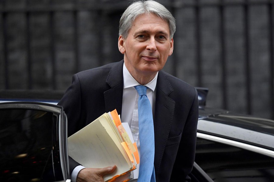 Britain's Chancellor of the Exchequer, Philip Hammond, arrives in Downing Street, in central London, Britain on December 6, 2018 — Reuters