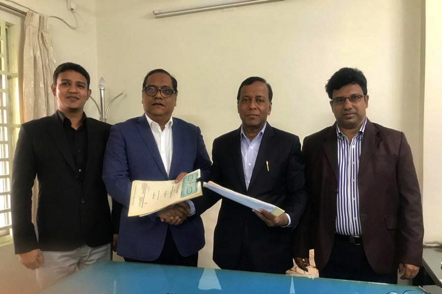 Sakhawat Hossain, Managing Director of Western Marine Shipyard, and Jahangir Alam Khan, Chairman of Pacific Eagle Ltd, exchanging documents after signing an agreement on behalf of their respective organisations on Saturday