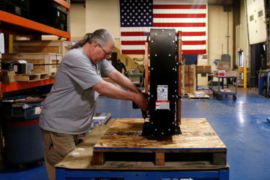 Receiving and shipping worker Mike Pawloski prepares to ship a newly assembled transformer to a client in the RoMan Manufacturing plant in Grand Rapids, Michigan, US, December 12, 2018. Reuters/Files