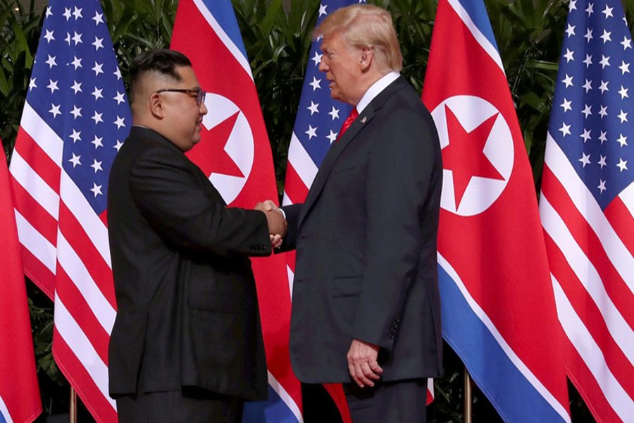 US President Donald Trump shakes hands with North Korean leader Kim Jong Un at the Capella Hotel on Sentosa island in Singapore, Jun 12, 2018. Reuters/File Photo