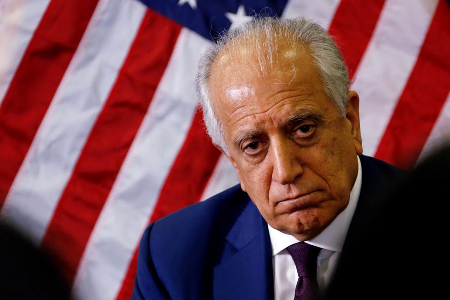 FILE PHOTO: US special envoy for peace in Afghanistan, Zalmay Khalilzad, talks with local reporters at the US embassy in Kabul, Afghanistan November 18, 2018 - US embassy/Handout via Reuters