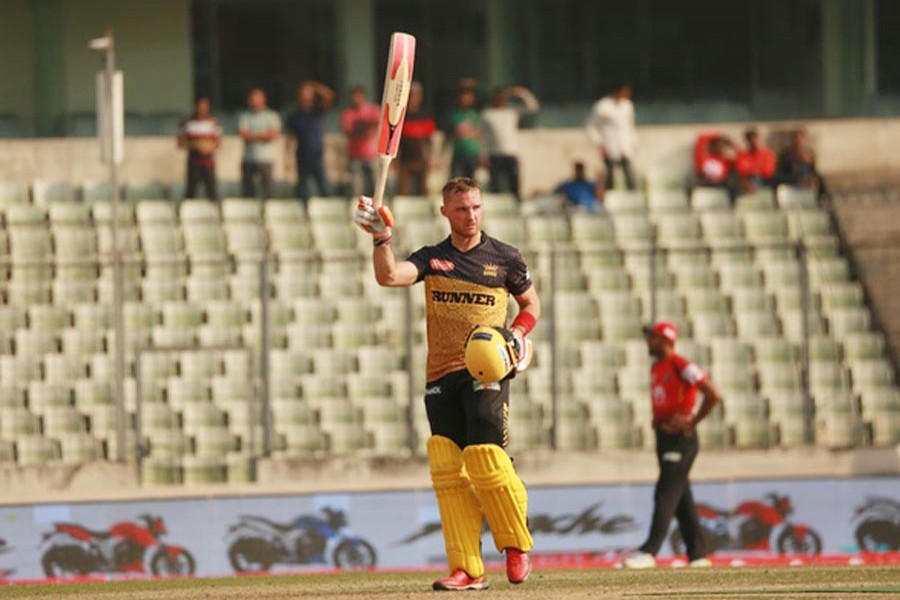 Rajshahi Kings' Laurie Evans celebrating after hitting a century against Comilla Victorians in BPL at Sher-e-Bangla National Cricket Stadium in the city on Monday	— bdnews24.com