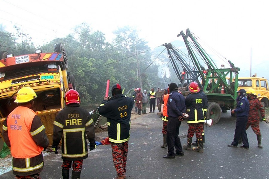 Police personnel and firefighters working to recover bodies after a goods-laden truck hit a Lakshmipur-bound CNG-run auto-rickshaw that killed seven people on the spot — Focus Bangla photo