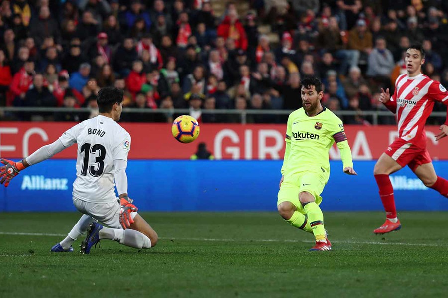 Barcelona's Lionel Messi scores his side's second goal against Girona on Sunday — Reuters photo