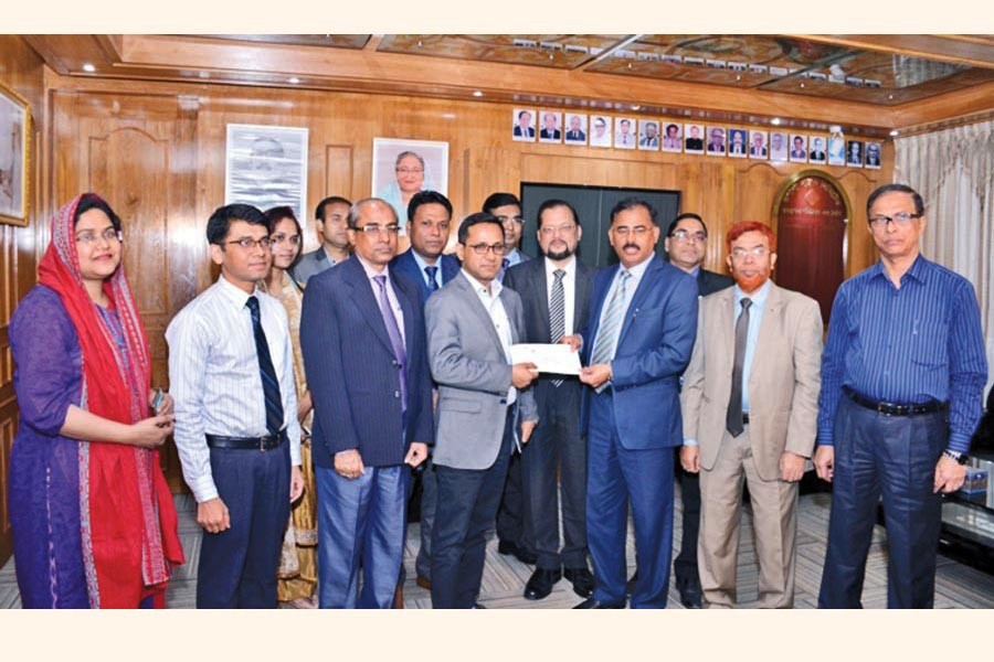 Ataur Rahman Prodhan, Managing Director & CEO of Rupali Bank Limited, handing over the pay order of the scheme to the first client under home loan to government employees at 5.0 per cent interest rate