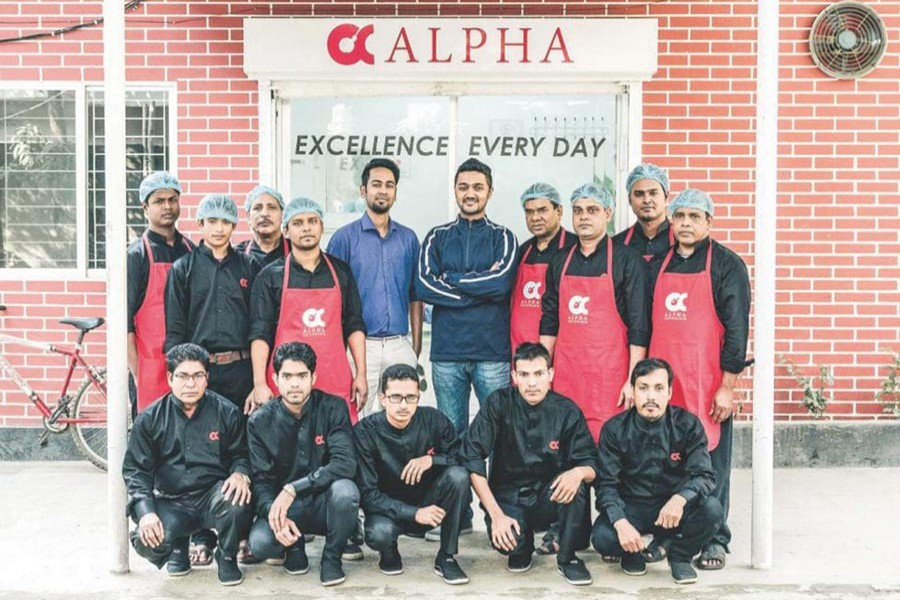 Muhammed Asif and Sayem Faruk are seen with their team of Alpha Catering