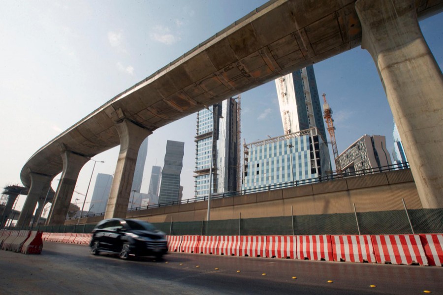 A car drives past a construction site of Riyadh Metro and the King Abdullah Financial District in Riyadh, Saudi Arabia, November 12, 2017. Reuters/Files