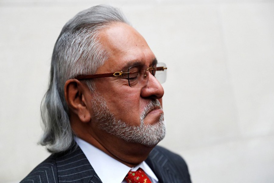 Vijay Mallya has a break outside the court house as he waits for his extradition case to be heard at Westminster Magistrates Court, in London, Britain, December 10, 2018. Reuters/Files