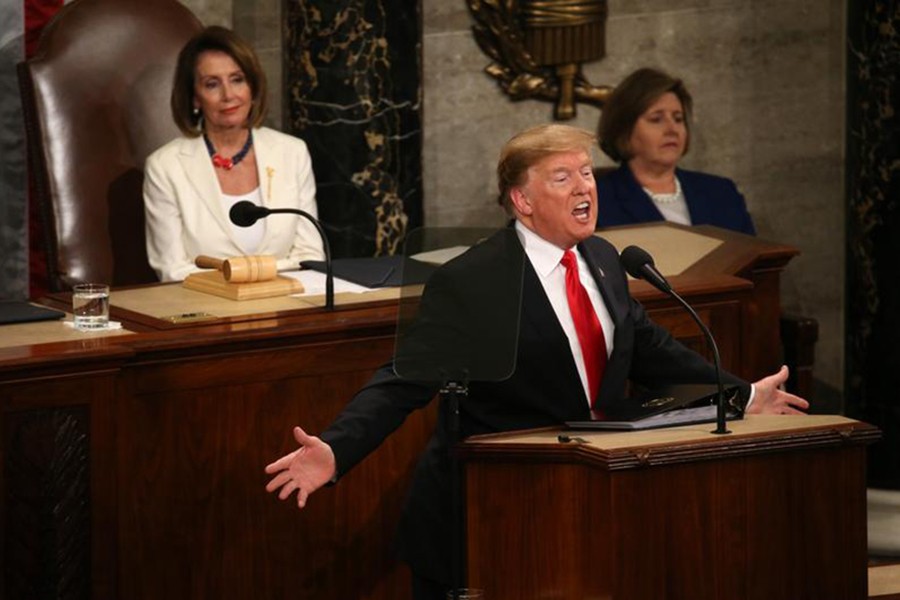 Speaker of the House Nancy Pelosi (L) watches as President Donald Trump delivers his second State of the Union address to a joint session of the US Congress in the House Chamber on Capitol Hill in Washington on Tuesday — Reuters