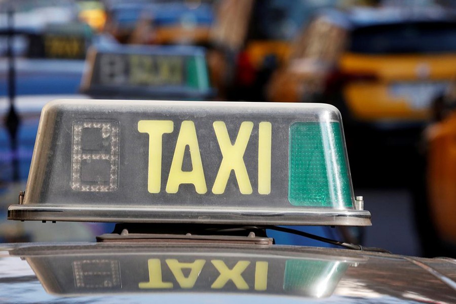 A taxi sign is seen during a strike against the VTC regulation, in Barcelona, Spain on January 19 last — Reuters photo