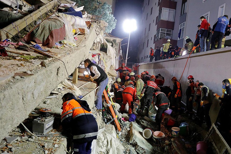 Rescue workers search for survivors at the site of a collapsed residential building in the Kartal district in Istanbul, Turkey on Wednesday — Reuters photo