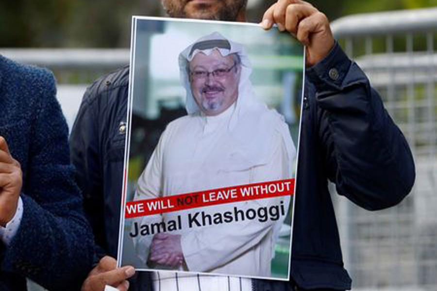 A demonstrator holds picture of Saudi journalist Jamal Khashoggi during a protest in front of Saudi Arabia's consulate in Istanbul, Turkey, October 5, 2018. Reuters/File Photo