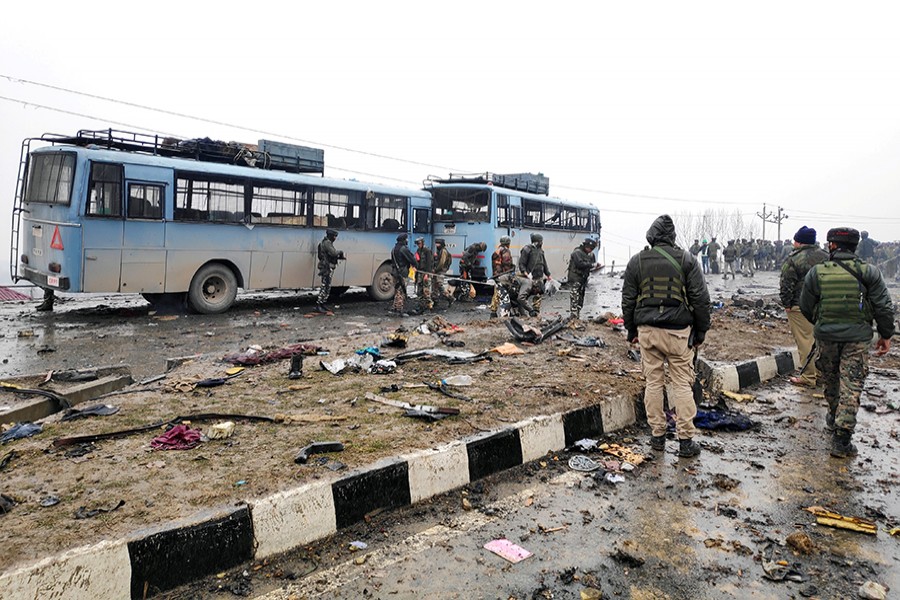 Indian soldiers examine the debris after an explosion in Lethpora in south Kashmir's Pulwama district on Thursday — Reuters photo