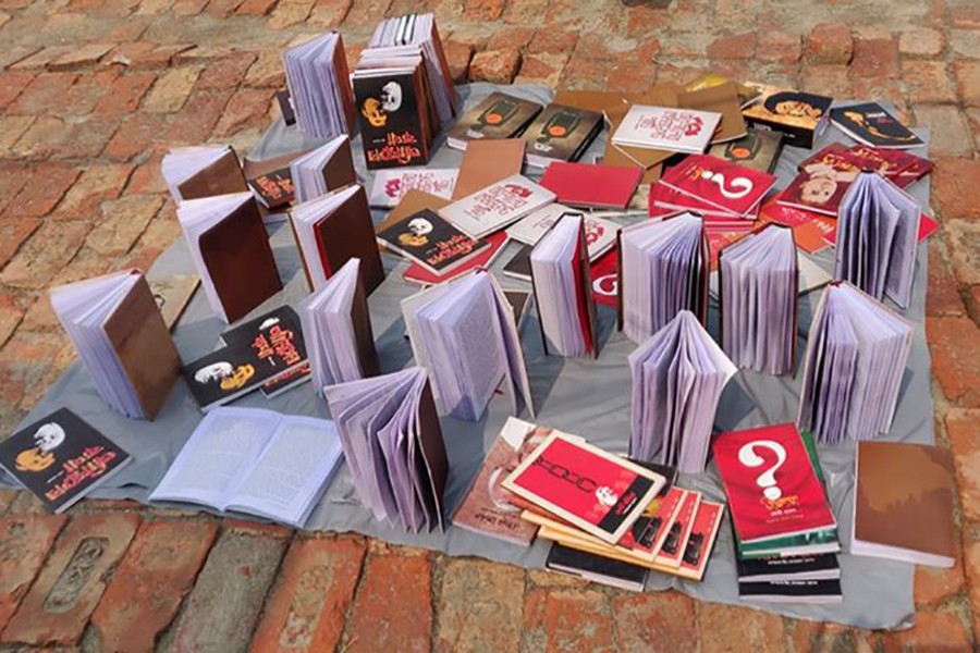 Books, soaked and damaged in heavy rains, are put in the sun to dry up on Sunday morning. Photo: Facebook