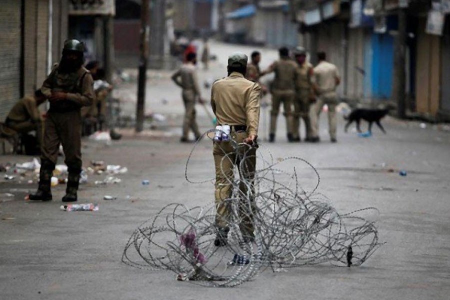 An Indian policeman pulls concertina wire to lay a barricade on a road during a curfew in Srinagar July 12, 2016 - Reuters file photo used for representation