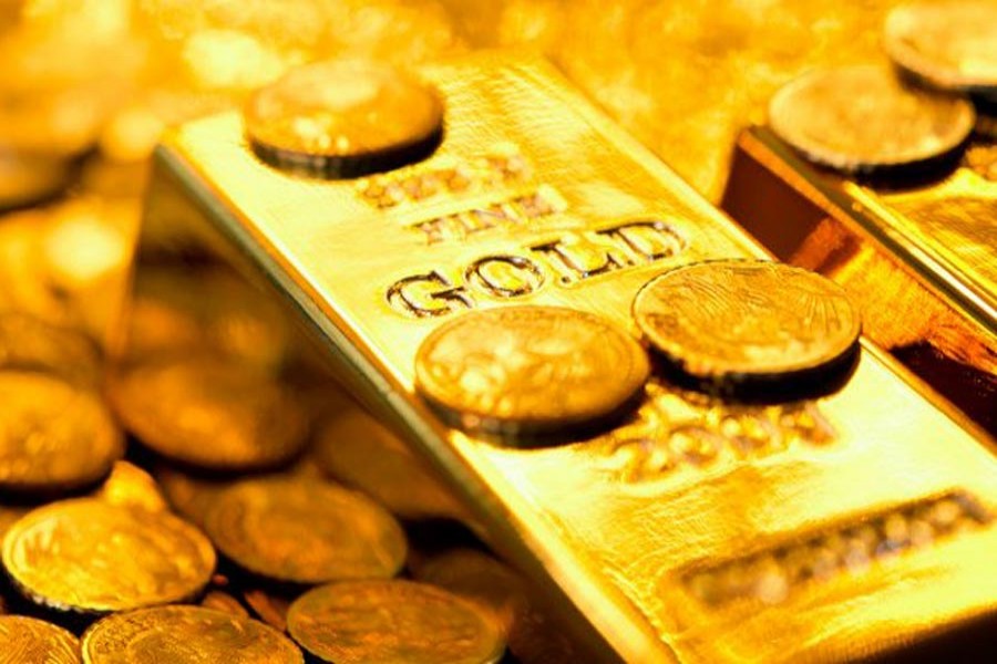 Gold holds close to 10-month highs