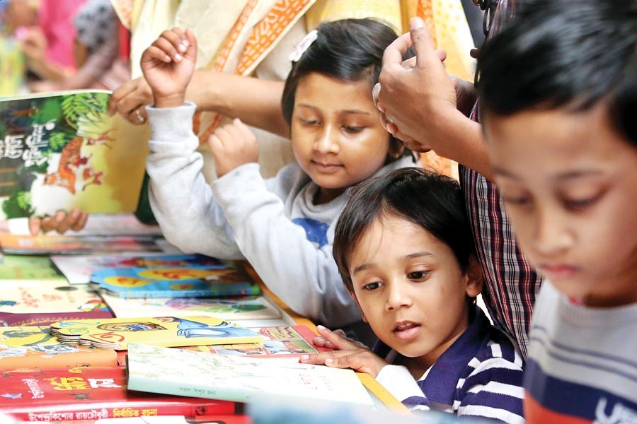 Children throng the Ekushey Grantha Mela (book fair) in Dhaka city	— FE file photo