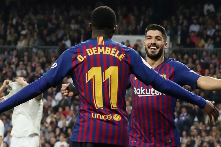 Barcelona's Luis Suarez celebrates their second goal with Ousmane Dembele on Wednesday night — Reuters photo