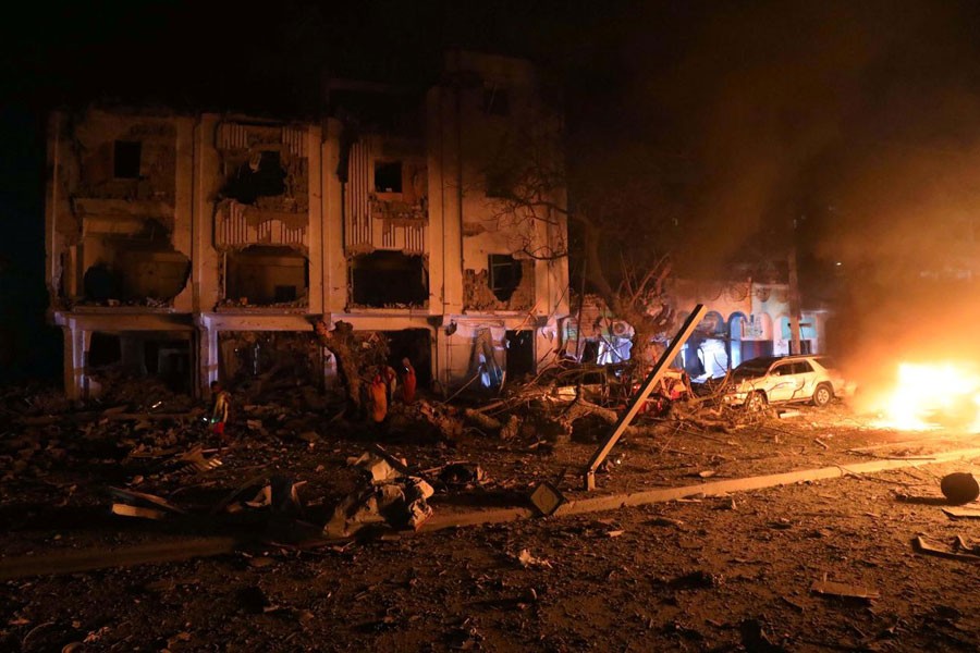 Flames are burning at the scene where a suicide car bomb exploded targeting a Mogadishu hotel in a business center in Maka Al Mukaram street in Mogadishu, Somalia, February 28, 2019 - REUTERS/Feisal Omar