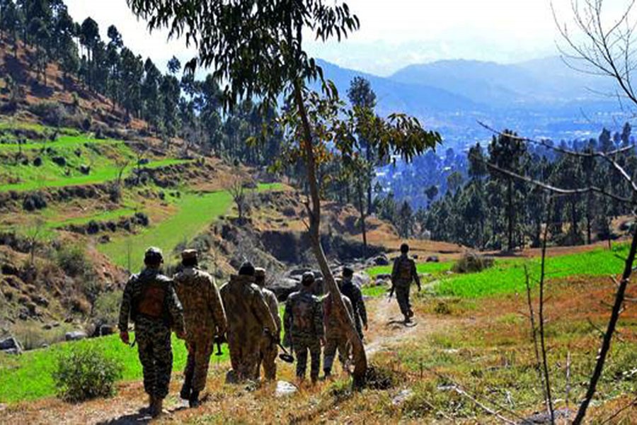 Pakistani soldiers patrol in the area where Indian planes were reportedly shot down by Pakistani forces earlier this week (AP)