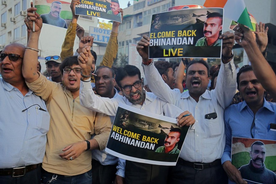 People celebrate before the release of Indian Air Force pilot, who was captured by Pakistan on Wednesday, in a street in Ahmedabad, India, March 1, 2019. Reuters