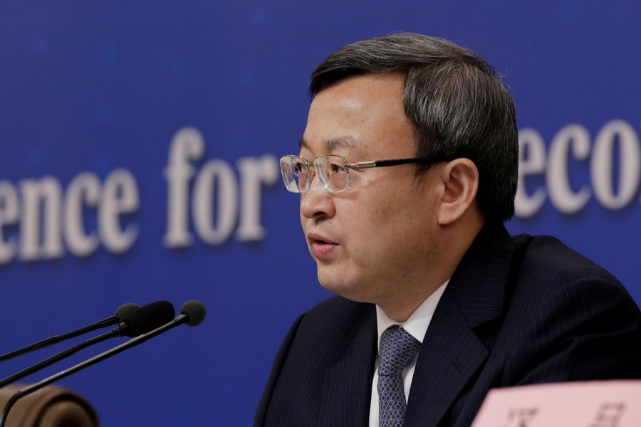 Chinese Vice Commerce Minister and Deputy China International Trade Representative Wang Shouwen attends a news conference during the ongoing session of the National People's Congress (NPC) in Beijing, China March 9, 2019. Reuters