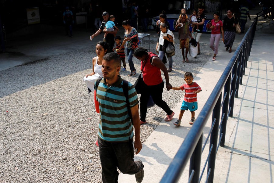 FILE PHOTO: People arrive to have lunch at an aid center and community kitchen where Venezuelans are assisted in Cucuta, Colombia February 27, 2019 - REUTERS/Marco Bello