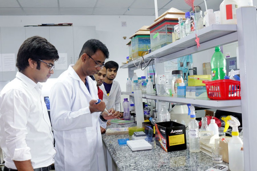 Prof Dr Abu Reza working at a laboratory at RU      	— FE Photo