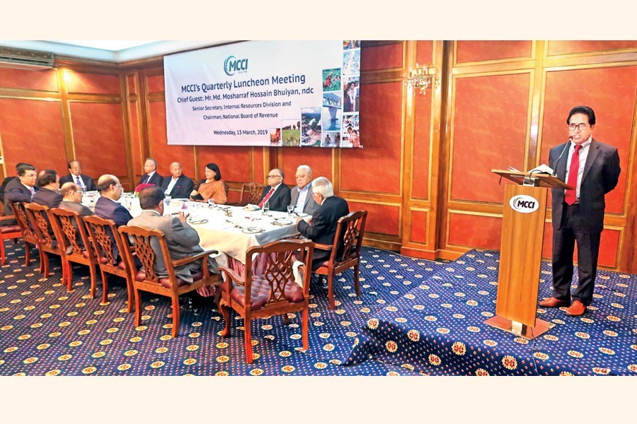 Senior Secretary, IRD and Chairman, National Board of Revenue Md Mosharraf Hossain Bhuiyan addressing the members of Metropolitan Chamber of Commerce and Industry, Dhaka (MCCI) at its first quarterly luncheon meeting at MCCI in the city on Wednesday — FE photo