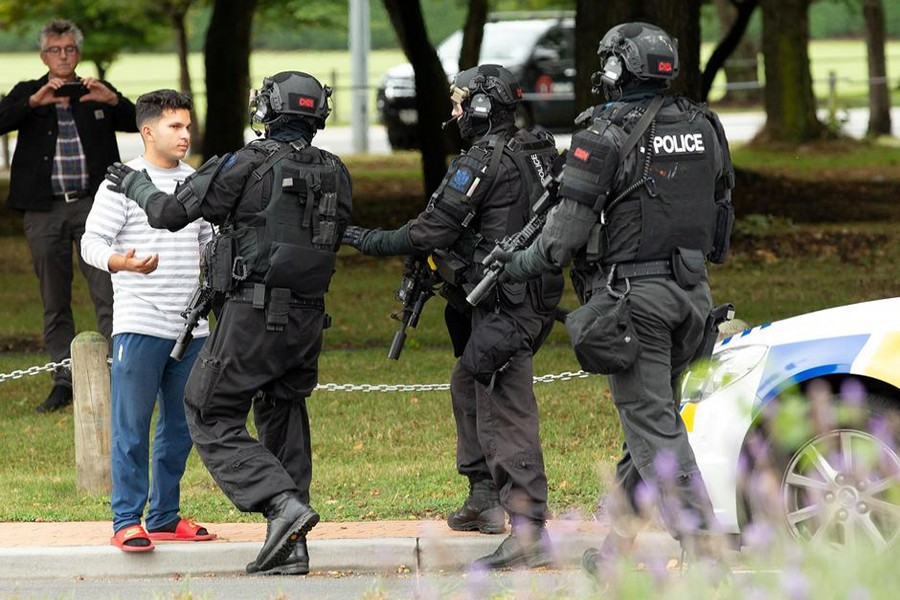 AOS (Armed Offenders Squad) push back members of the public following a shooting at the Masjid Al Noor mosque in Christchurch, New Zealand on March 15, 2019 — Reuters photo