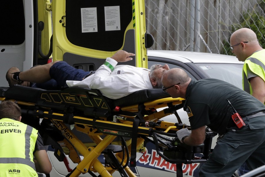 Ambulance staff take a man from outside a mosque in central Christchurch, New Zealand, Friday, March 15, 2019, following a mass shooting - AP/Mark Baker