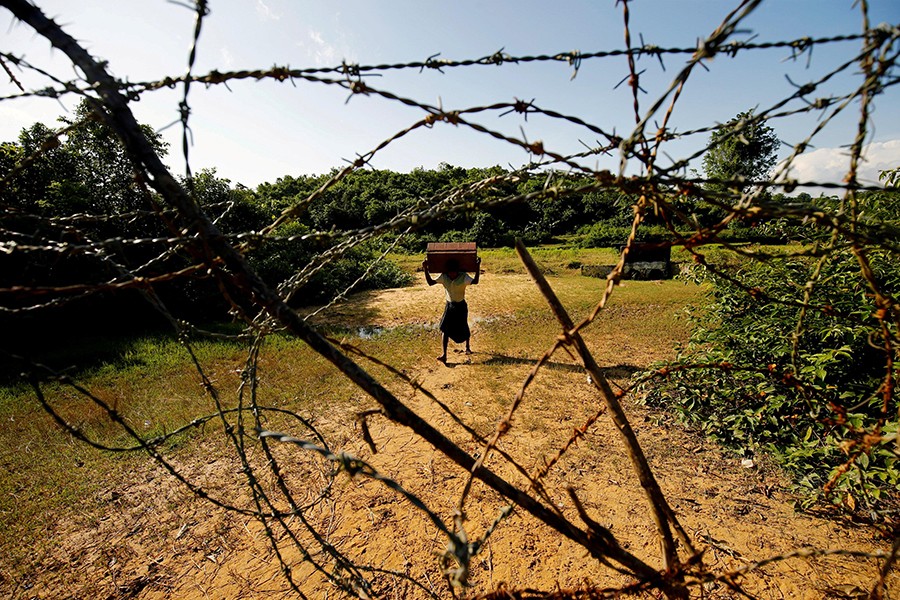 A Rohingya man carrying his belongings approaches the Bangladesh-Myanmar border in Bandarban, an area under Cox's Bazar authority, Bangladesh on August 29, 2017 — Reuters file photo used only for representation