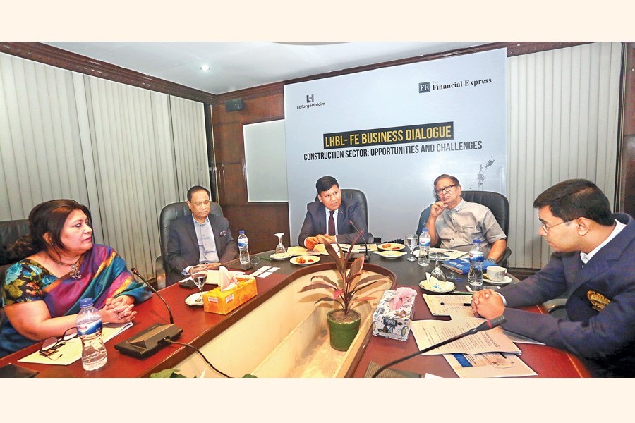 LafargeHolcim Bangladesh CEO Rajesh Surana addressing LHBL-FE Business Dialogue on "Construction Sector: Opportunities and Challenges" at a convention centre in the city on Wednesday. The Financial Express Editor Shah Husain Imam was present on the occasion, among others — FE photo