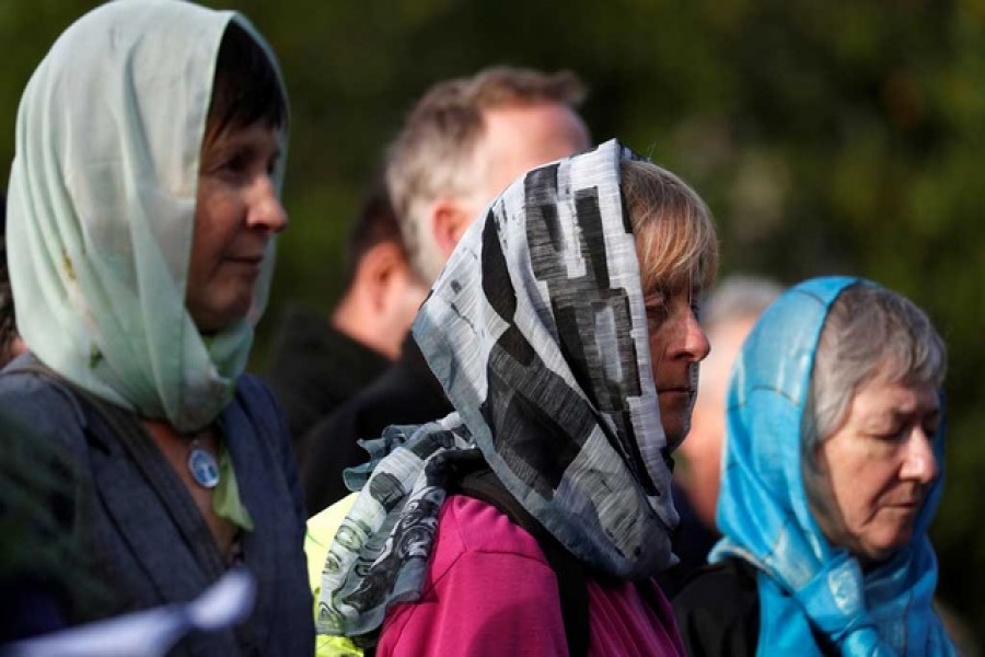 Women attend a vigil for the victims of the mosque attacks during an ecumenical celebration in Christchurch, New Zealand, March 21, 2019. Reuters