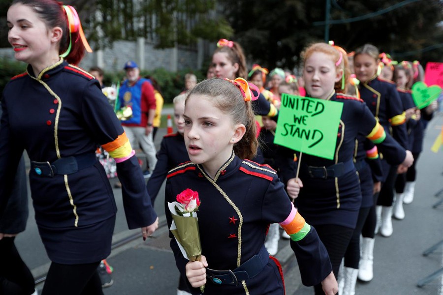 People take part in the "March for Love" at North Hagley Park after the mosque attacks in Christchurch, March 23, 2019. Reuters