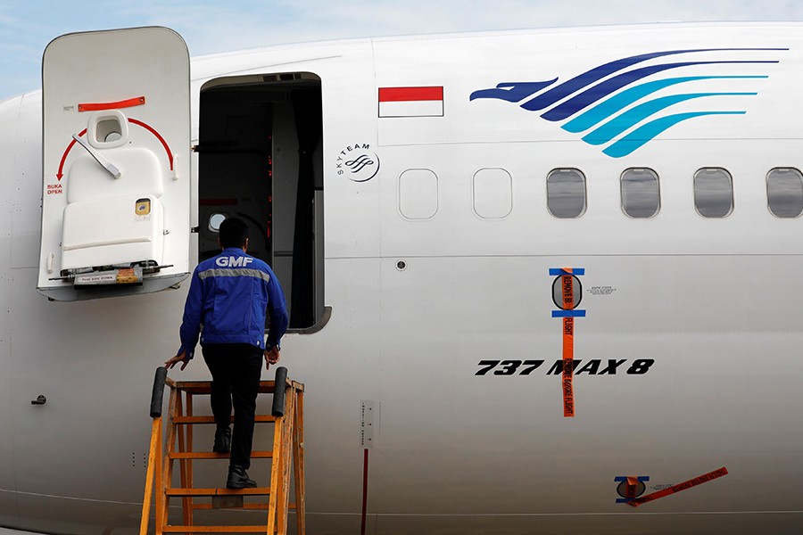 A technician prepares to check Garuda Indonesia's Boeing 737 Max 8 airplane parked at the Garuda Maintenance Facility AeroAsia, at Soekarno-Hatta International airport near Jakarta, Indonesia on March 13, 2019  Reuters photo