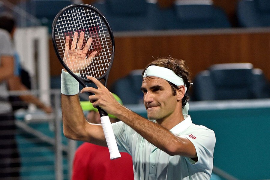 Roger Federer of Switzerland returns a shot back to Denis Shapovalov of Canada (not pictured) during the menÕs semifinal at the Miami Open at Miami Open Tennis Complex on Friday — USA Today Sports photo via Reuters